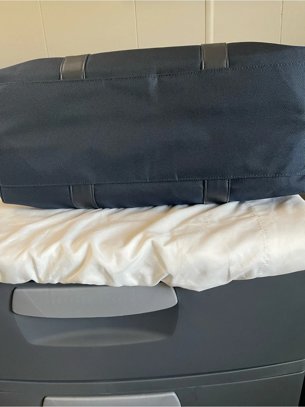 Large navy travel duffel from Jimmy Choo Parfums Durable fabric with leather